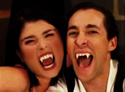 Dracula Fangs on Man and Woman