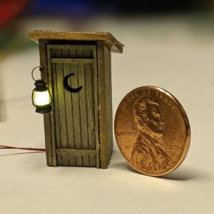 HO 1:87 scale out house with lit miniature hurrican lamp